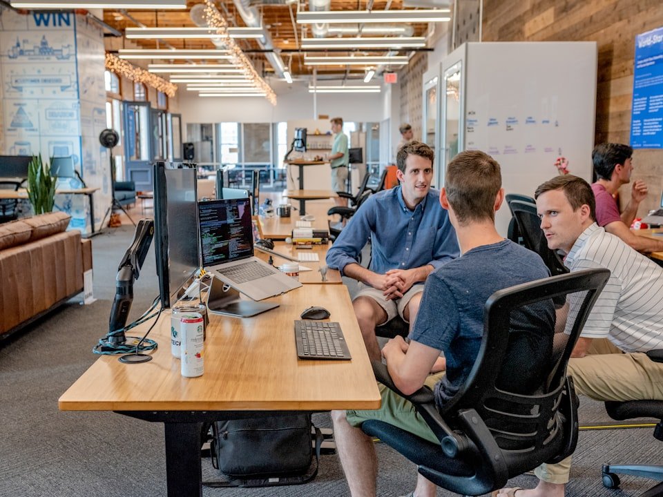 A professional team discussing brand strategy in a meeting room.